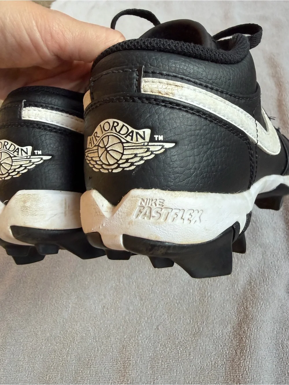 Nike Kids Black and White Baseball Cleats with Swoosh